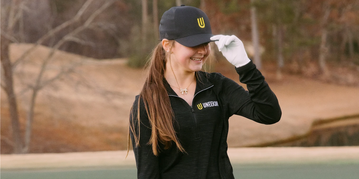 Young girl with Uneekor baseball cap